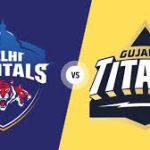Two logos facing each other. Left logo says "Delhi Capitals" in blue, with a tiger mascot. Right logo says "Gujarat Titans" in orange, with a roundel featuring a lion.
