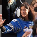 Sunita Williams, a female astronaut, floats in the ISS with a joyful expression, mid-dance.